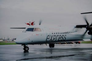 Santa Claus waves from Air Canada express aircraft.