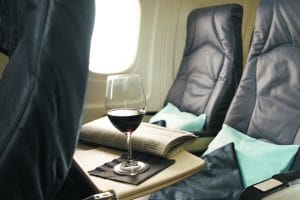 Pillow and Wine inside Airplane