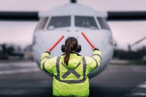 Air traffic controller directs an aircraft.